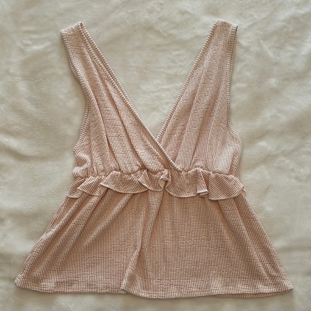 White tank top with ruffles and salmon colored stripes
